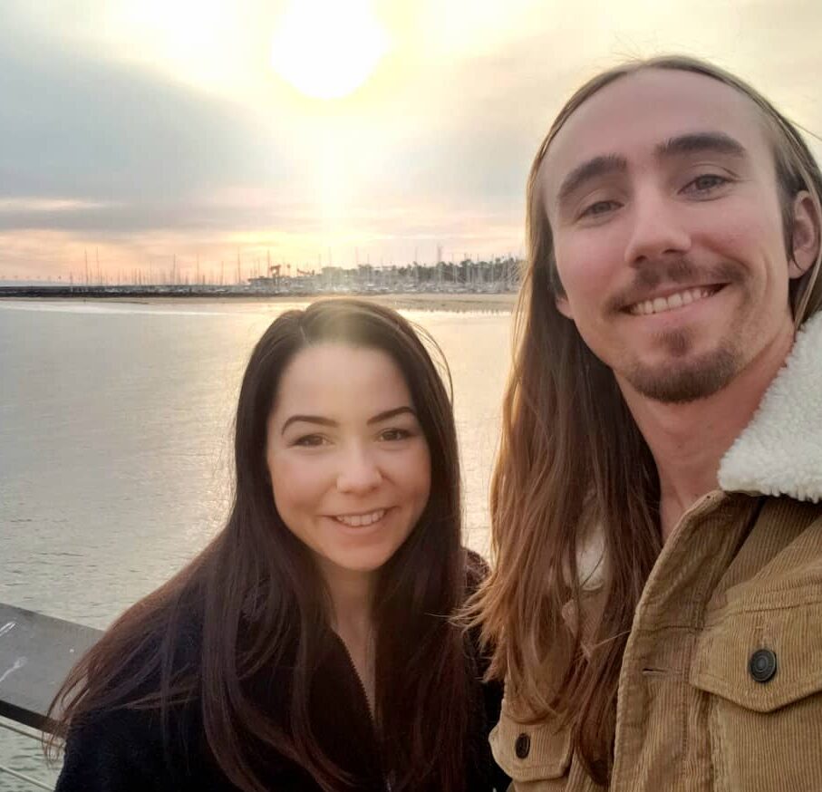 Nick and Merisa Smiling by harbor